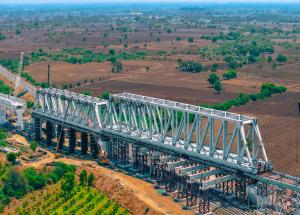 130 m long span of steel bridge launched over Indian railway tracks for Mumbai-Ahmedabad Bullet Train Project
